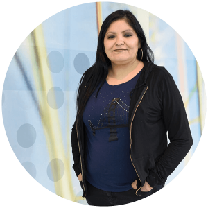 Patricia poses in front of the Sunrise Community Link centre, a United Way partner agency