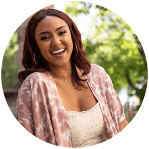 Priscilla smiles outside the Canadian Mental Health Association