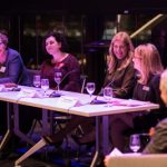 A panel of local female leaders speak at a Women United event.