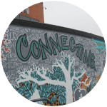 A murral at Village Square Leisure Centre reads ``Community``.