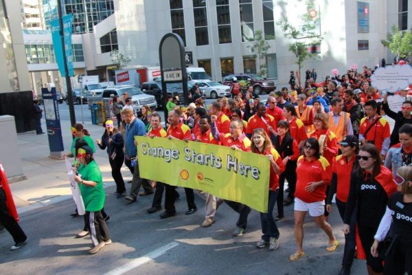 Shell employees walking in a celebration of community.